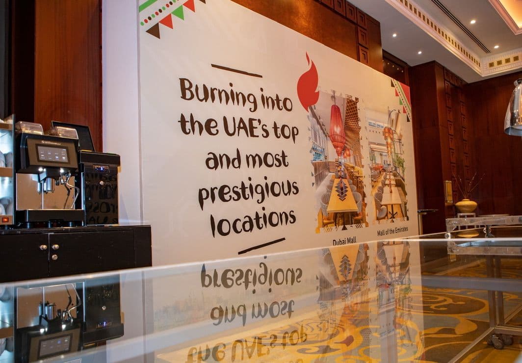Nando's 'Burning into the UAE's top and most prestigious locations' wall graphic